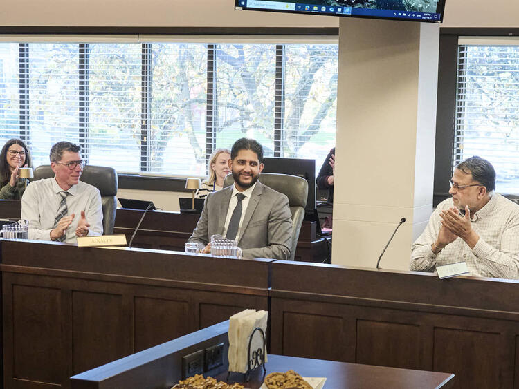 Arsh Kaler seated at the Abbotsford Board of Education table during a public board meeting